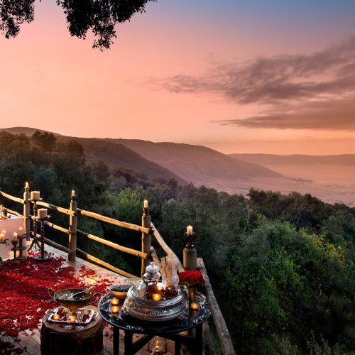 Header romantic dinner with rose petals overlooking the ngorongoro crater on a luxury tanzania safari 1